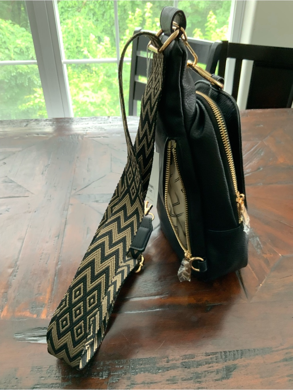 Moda Luxe Black Sling Bag with Patterned Chevron Strap - Picture 3 of 7
